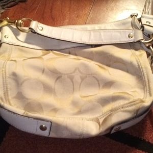 Cream colored coach purse